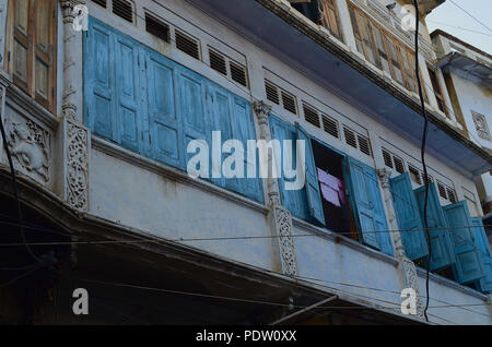 Cloths kept for drying at an Indian village balcony Stock Photo