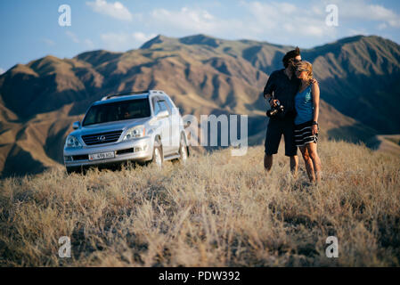 A couple having fun in Kyrgyzstan Stock Photo