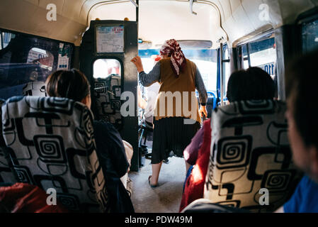 People on the streets of Karakol, Kyrgyzstan Stock Photo