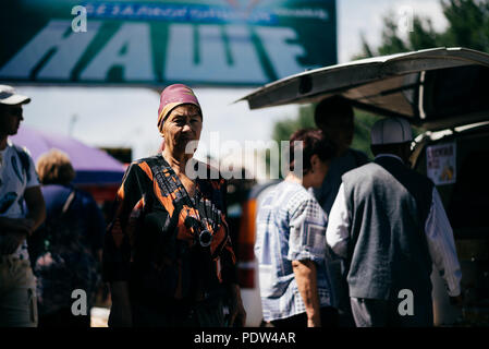 People on the streets of Karakol, Kyrgyzstan Stock Photo