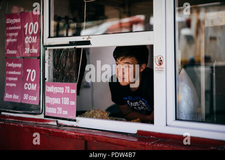 People on the streets of Karakol, Kyrgyzstan Stock Photo