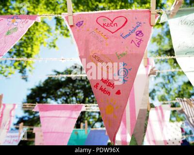 Colorful flags decorate the streets in Cologne, Germany at the day of good life in the Agnes quarter. Stock Photo