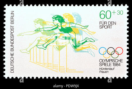 German postage stamp (Berlin: 1984) : 'Fur den Sport' (charity stamp funding sport) 1984 Olympics: women's hurdles Stock Photo
