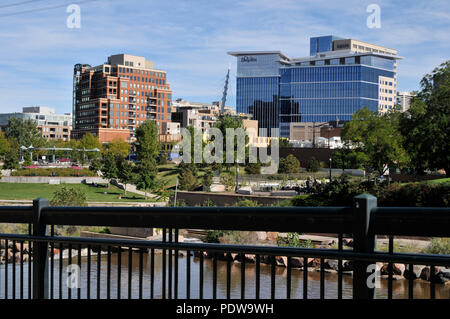 A view of downtown Denver from Confluence Park, where the Cherry Creek and South Platte Rivers meet Stock Photo