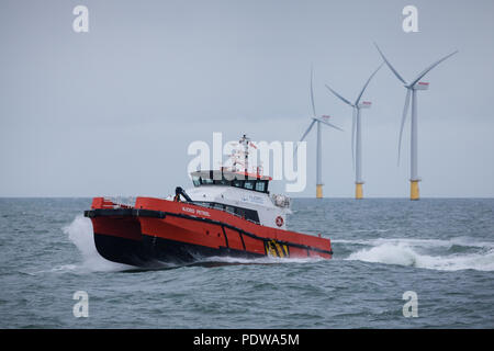 A wind farm crew transfer vessel, catamaran, moored at ...