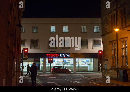 Tesco Metro store in Castle Street, Salisbury, Wiltshire, England at night Stock Photo