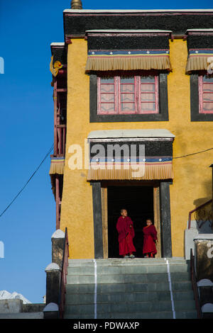 LADAKH, INDIA - MAY 6' 2015: Lillte Tibetan monks standing in front of the monastery in the temple. This temple is one of the holiest sites in Tibetan Stock Photo