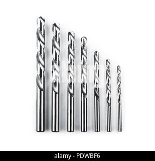 Drill bits of different sizes isolated over white background Stock Photo