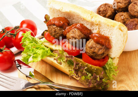 Homemade spicy meatball sub sandwich with marinara sauce and tomatoes Stock Photo