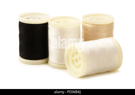 Four bobbin thread isolated on white background Stock Photo