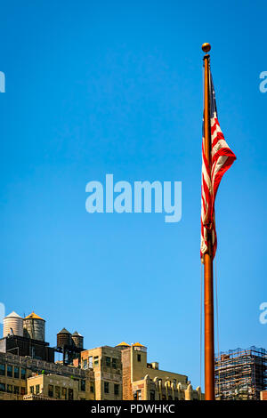 A flag sits idle on a windless day in New York City. Stock Photo