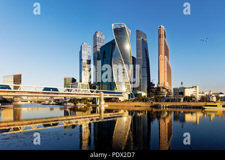 High rise buildings of Moscow International Business Centre (MIBC) and Bagration pedestrian bridge at sunrise. Moscow, Russia. Stock Photo