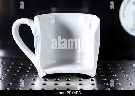 https://l450v.alamy.com/450v/pdxabd/close-up-on-white-espresso-coffee-cup-broken-in-half-placed-on-home-espresso-machine-concept-of-bad-morning-pdxabd.jpg