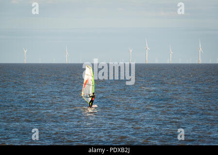 A windsurfer in the water at Clacton on Sea, Essex, UK Stock Photo