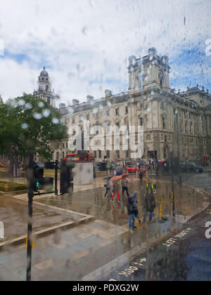 Westminster. London. UK 10 Aug 2018 - View of Parliament Square through a double decker bus window covered with raindrops.  Credit Roamwithrakhee /17�Թ����� Live News Stock Photo