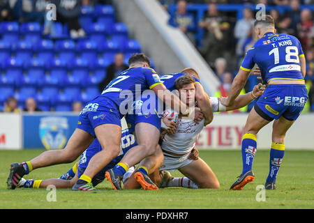 Warrington, UK, 10th August 2018 , Halliwell Jones Stadium, Warrington, England;  Betfred Super League Super 8s, Warrington Wolves v Catalans Dragons ; Thibaud Margalet of Catalans Dragaons is pinned down by the Warrington defense Credit: News Images /Alamy Live News Stock Photo
