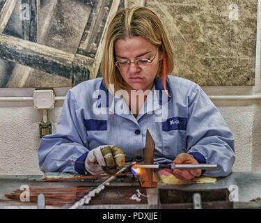 Manacor, Mallorca, Spain. 18th Oct, 2004. Women at work in the Majorica pearl factory in the town of Manacor in Spanish Mallorca. Its famous man-made manufactured pearls are fabricated here in a delicate production process Invented in 1890 that is visible to tourists. Credit: Arnold Drapkin/ZUMA Wire/Alamy Live News Stock Photo