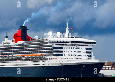 Southampton, UK, 10 Aug 2018. Cunard 's flag ship and a true ocean liner Queen Mary 2, getting steam-up at Southampton  Docks  for her departure  along with Cunard Line's  sister ships Queen Victoria and   Elizabeth 2.(QE2)  .Credit Gary Blake /Alamy Live Stock Photo