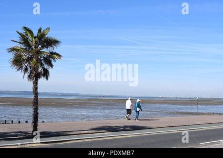 Southend-on-Sea, Essex, UK. 11th August, 2018. UK Weather: A warm start to the day in Southend - a view of people walking along the sea front Credit: Ben Rector/Alamy Live News