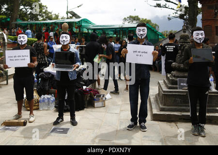 Kathmandu, Nepal. 11th Aug, 2018. Activists wearing masks take part in an awareness campaign in opposition to violence against animals at Swayambhunath Stupa premise in Kathmandu, Nepal on Saturday, August 11, 2018. Credit: Skanda Gautam/ZUMA Wire/Alamy Live News Stock Photo