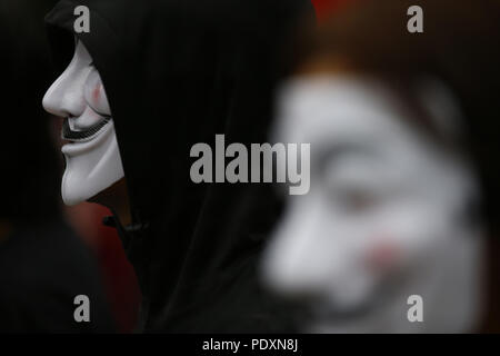 Kathmandu, Nepal. 11th Aug, 2018. An activist wearing a mask takes part in an awareness campaign in opposition to violence against animals at Swayambhunath Stupa premise in Kathmandu, Nepal on Saturday, August 11, 2018. Credit: Skanda Gautam/ZUMA Wire/Alamy Live News Stock Photo