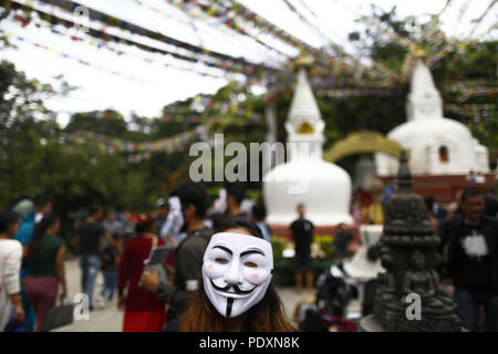 Kathmandu, Nepal. 11th Aug, 2018. An activist wearing a mask takes part in an awareness campaign in opposition to violence against animals at Swayambhunath Stupa premise in Kathmandu, Nepal on Saturday, August 11, 2018. Credit: Skanda Gautam/ZUMA Wire/Alamy Live News Stock Photo