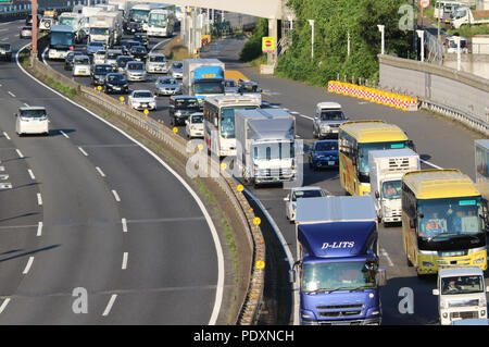 Tokyo, Japan. 11th Aug, 2018. Motorists are caught in a traffic jam along a highway in Tokyo on Saturday, August 11, 2018. Major railroad stations, airports and highways were crowded with travelers heading for resorts and hometowns for the Bon holidays in Japan. Credit: Yoshio Tsunoda/AFLO/Alamy Live News Stock Photo