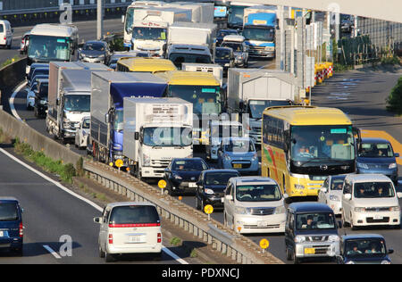 Tokyo, Japan. 11th Aug, 2018. Motorists are caught in a traffic jam along a highway in Tokyo on Saturday, August 11, 2018. Major railroad stations, airports and highways were crowded with travelers heading for resorts and hometowns for the Bon holidays in Japan. Credit: Yoshio Tsunoda/AFLO/Alamy Live News Stock Photo