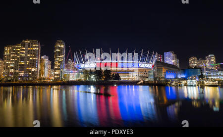 VANCOUVER, BC, CANADA - NOV 16,2015: BC Place, in False Creek, displaying the French tricolore as a show of support in the week following the attacks in Paris. Stock Photo