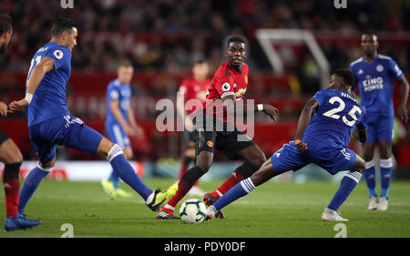 Manchester United's Paul Pogba (centre) in action during the Premier League match at Old Trafford, Manchester. Stock Photo