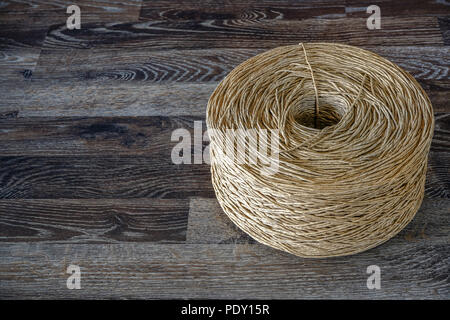 An old rolled cotton cord. It was used for various purposes. For bonding straw, hay, making thick roses. While today it is used to decorate a variety  Stock Photo