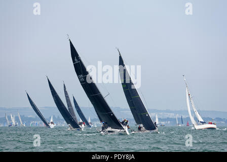 Close racing between yachts Davanti Tyres, Njo Sails and No Retreat at the annualk Cowes Week regatta Stock Photo