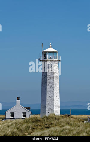 Walney Lighthouse stands at the South end of Walney Island near Barrow in Furness, Cumbria in the North West of England Stock Photo