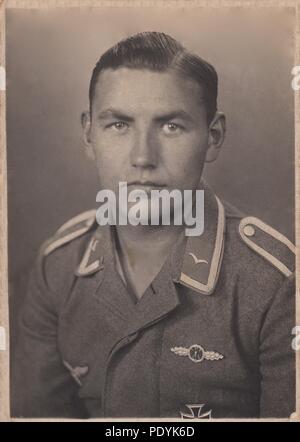 Image from the photo album of Feldwebel Willi Hoffmann of 5. Staffel, Kampfgeschwader 30: A very nice studio portrait of Unteroffizier Willi Hoffmann of 5./KG 30, taken in spring 1941. Hoffmann is wearing the Bomber Clasp in Silver (for completion of 60 missions) and Iron Cross 1st Class. Will Hoffmann and his entire crew failed to return from a mission in the Mediterranean on 23rd January 1943. Stock Photo