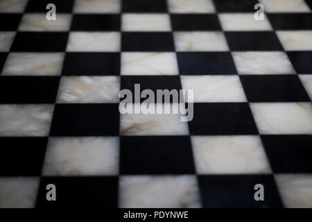 Chess board checkered patterned surface in marble. Stock Photo