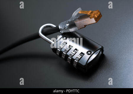 Network Ethernet Cable Secured By A Combination Lock - Internet Security Concept Stock Photo
