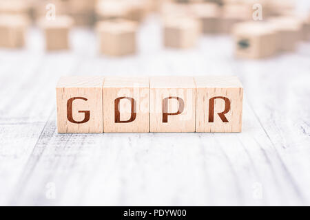 The Word GDPR Formed By Wooden Blocks On A White Table, Reminder Concept Stock Photo