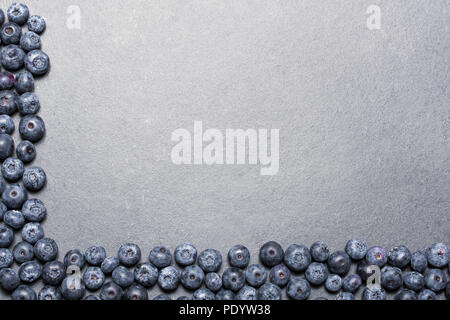 Top Down View On A Border Of Blueberries On Slate Stone Stock Photo
