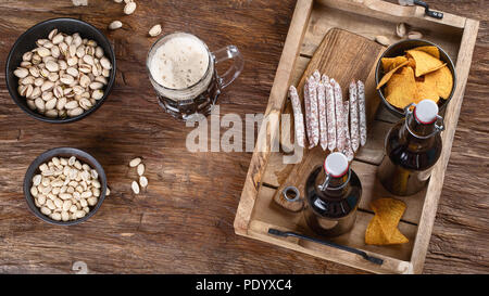 Beer and snacks on wooden background. Top view Stock Photo