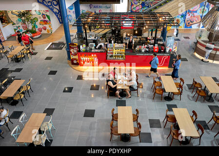 Overhead view of the restaurant dining area in a Thailand shopping mall. Diners from above. Southeast Asia.