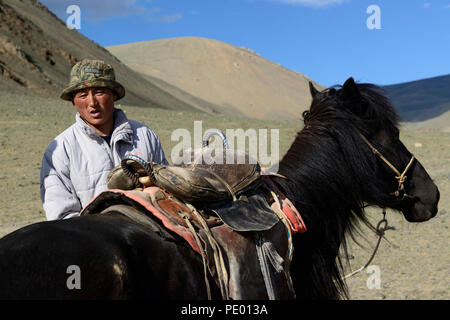 A boy and his horse on the steppe of Mongolia. Stock Photo