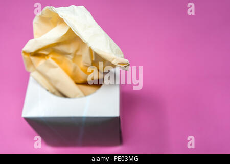 Facial Tissue Cube Box. Peach colored tissue paper. Stock Photo