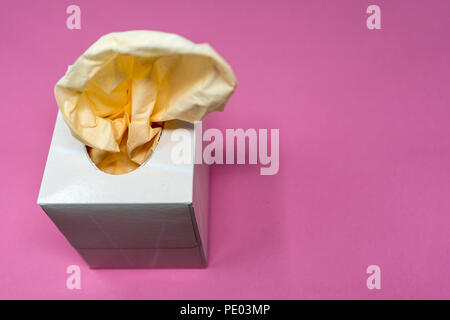 Facial Tissue Cube Box. Peach colored tissue paper. Stock Photo