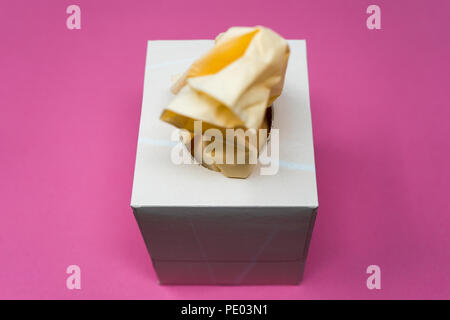 Facial Tissue Cube Box. Peach colored tissue paper. Stock Photo