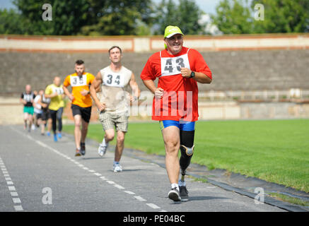 Disabled athlete with an artificial leg running on track. Trials among Ukrainian soldiers to 43 US Marine Corps marathon. July 20, 2018. Kiev,Ukraine Stock Photo