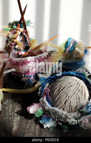 Cut nylon bag into yarn and knit to basket, good idea to recycle nylon bag to reduce environmental pollution Stock Photo