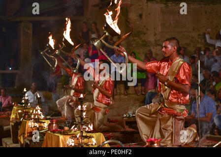 Hindu priests performing evening Ganga Aarti ceremony, Dashashwamedh ghat, Varanasi, India Stock Photo