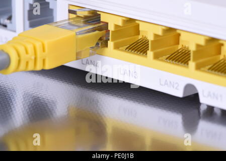 Network router with ethernet cable close up Stock Photo
