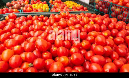 Tomatos Arranged for Sale in Farmer's Market Stock Photo