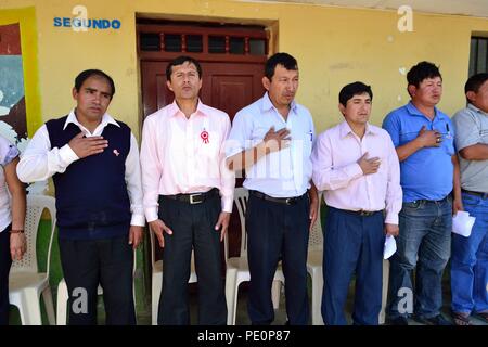 Singing the national anthem - Fiestas Virgen del Carmen in El CARMEN DE LA FRONTERA - Ecuador border -. Department  of Piura .PERU        Stock Photo